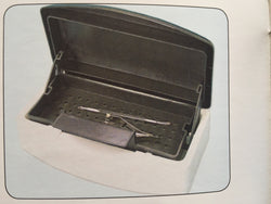 Disinfectant tray, lowers instruments when lid close.